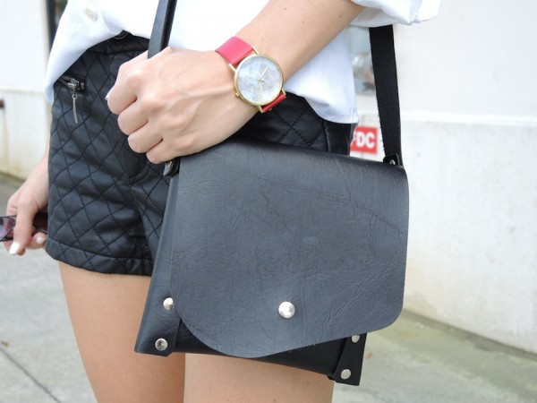 quilted leather shorts with black bag and red world map watch